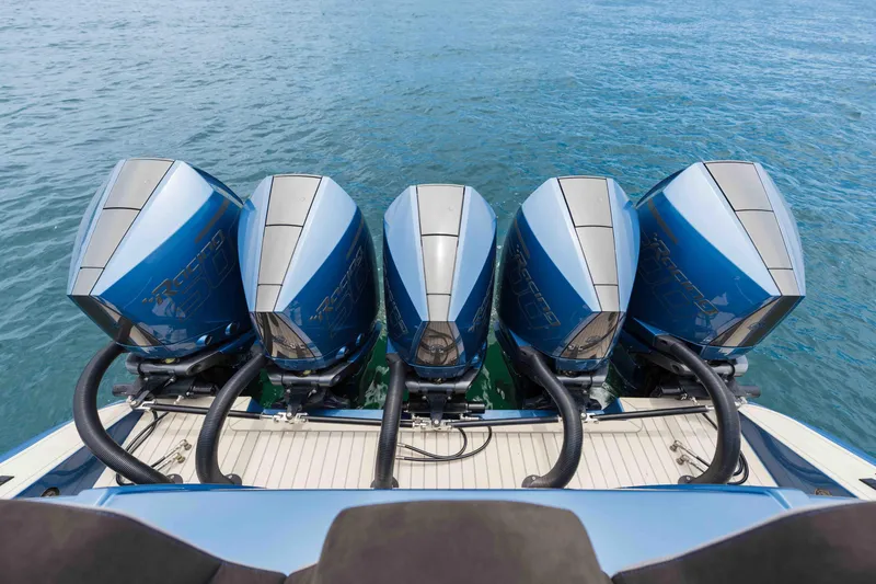 Slide: The Image of Four powerful outboard motors on a 2026 Midnight Express 52 Vitesse boat. - 21