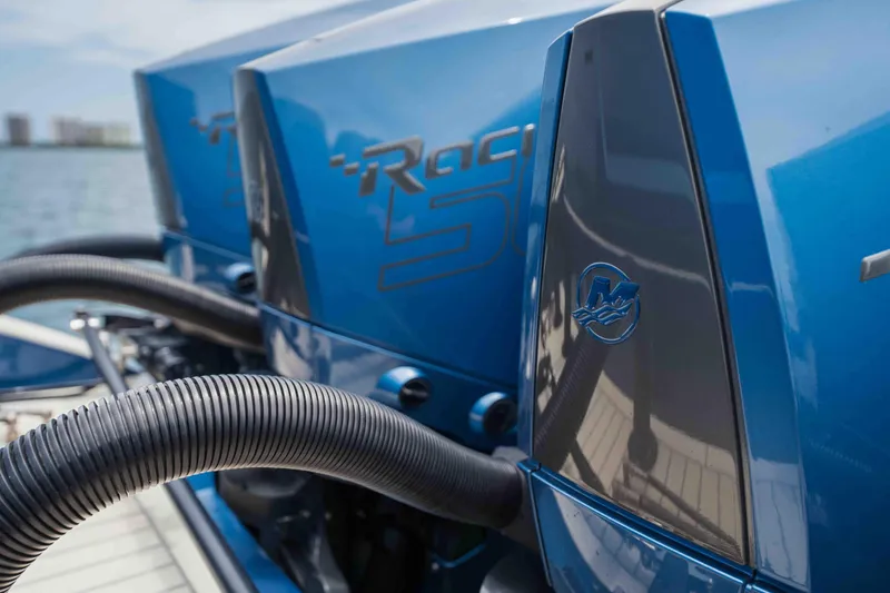 Slide: The Image of Close-up of 2026 Midnight Express 52 Vitesse boat engines, showcasing sleek blue design. - 22