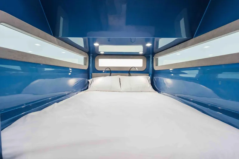 Slide: The Image of Luxurious cabin interior of 2026 Midnight Express 52 Vitesse with sleek blue design. - 50