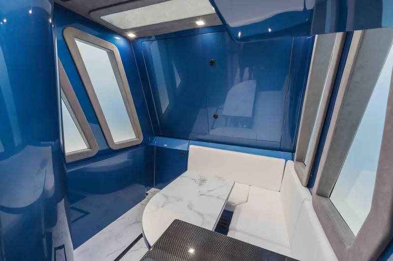 Slide: The Image of Luxurious interior of 2026 Midnight Express 52 Vitesse with sleek blue and white design. - 42