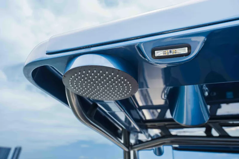 Slide: The Image of Close-up of 2026 Midnight Express 52 Vitesse boat's showerhead and light fixture. - 24