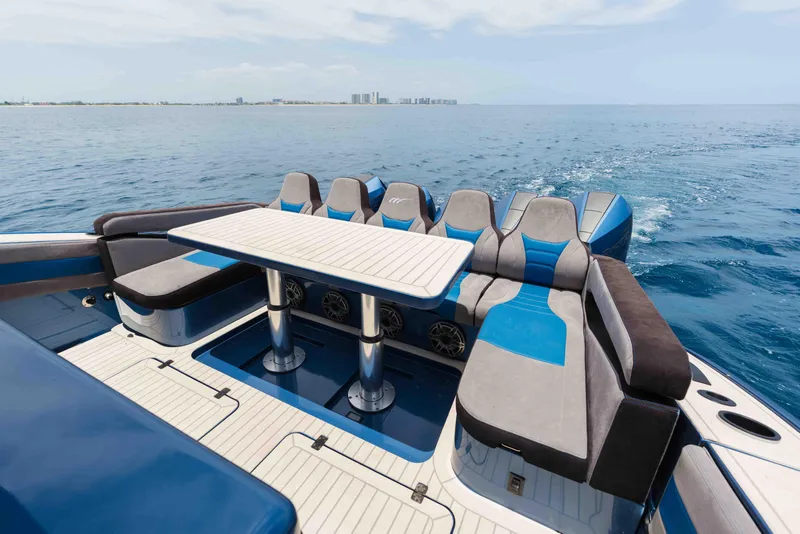 Slide: The Image of Luxurious seating area on 2026 Midnight Express 52 Vitesse yacht, cruising on open water. - 35