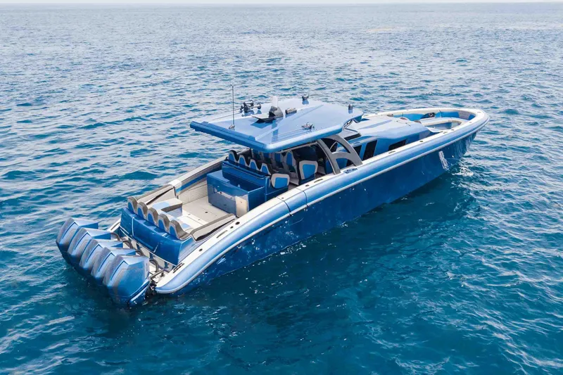Slide: The Image of 2026 Midnight Express 52 Vitesse luxury yacht cruising on open blue sea. - 8