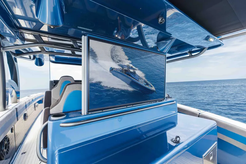 Slide: The Image of 2026 Midnight Express 52 Vitesse luxury boat with sleek design and ocean view. - 38