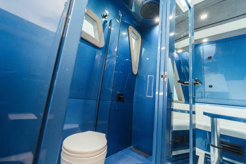 Slide: The Image of Luxurious blue bathroom interior of 2026 Midnight Express 52 Vitesse yacht. - 46