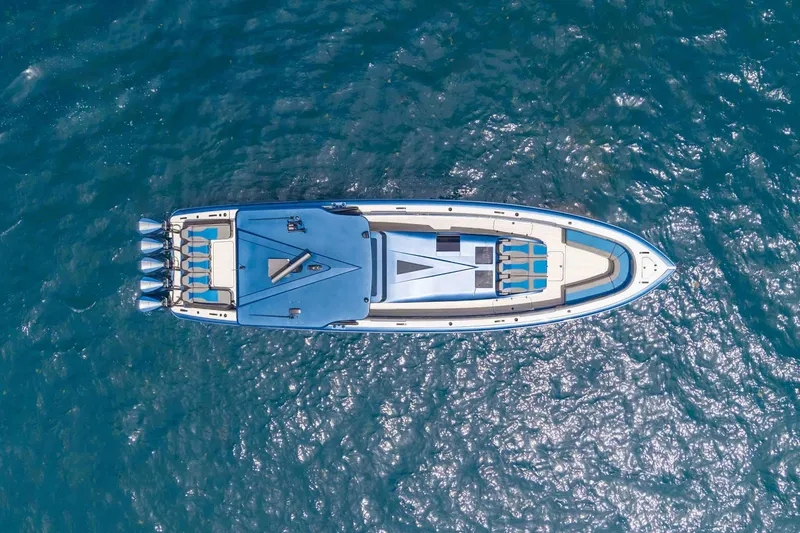 Slide: The Image of Aerial view of 2026 Midnight Express 52 Vitesse yacht on shimmering blue water. - 4