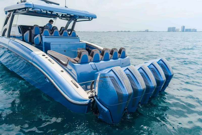 Slide: The Image of 2026 Midnight Express 52 Vitesse luxury speedboat with multiple outboard engines on open water. - 9