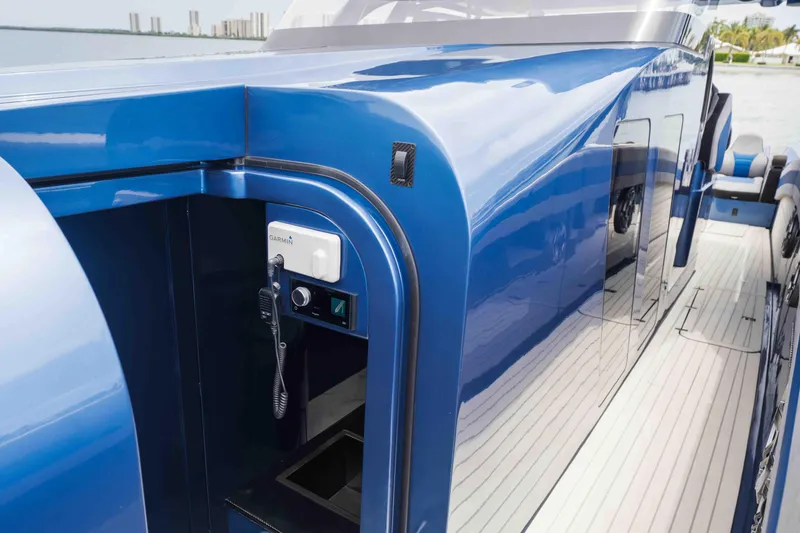 Slide: The Image of 2026 Midnight Express 52 Vitesse yacht with sleek blue exterior and modern navigation equipment. - 39
