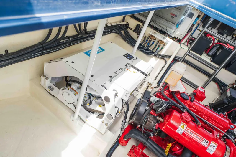 Slide: The Image of Engine compartment of 2026 Midnight Express 52 Vitesse, showcasing advanced mechanical components. - 53