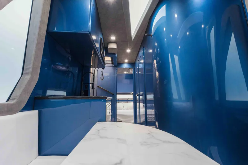 Slide: The Image of Luxurious interior of 2026 Midnight Express 52 Vitesse with sleek blue design and modern amenities. - 44