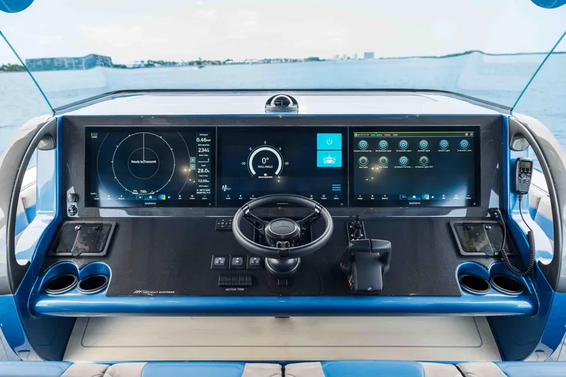 Slide: The Image of Helm of 2026 Midnight Express 52 Vitesse boat with advanced navigation displays. - 27