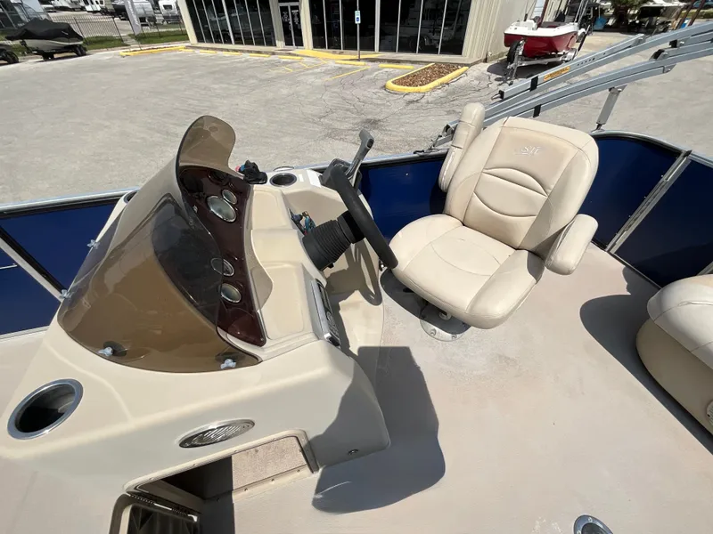 Slide: The Image of The image shows the helm of a 2016 SilverWave 210L with a beige seat and steering wheel. - 9