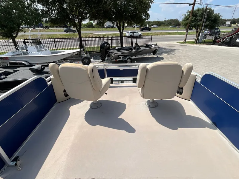 Slide: The Image of The image shows the deck of a 2016 SilverWave 210L with two swivel seats. - 11