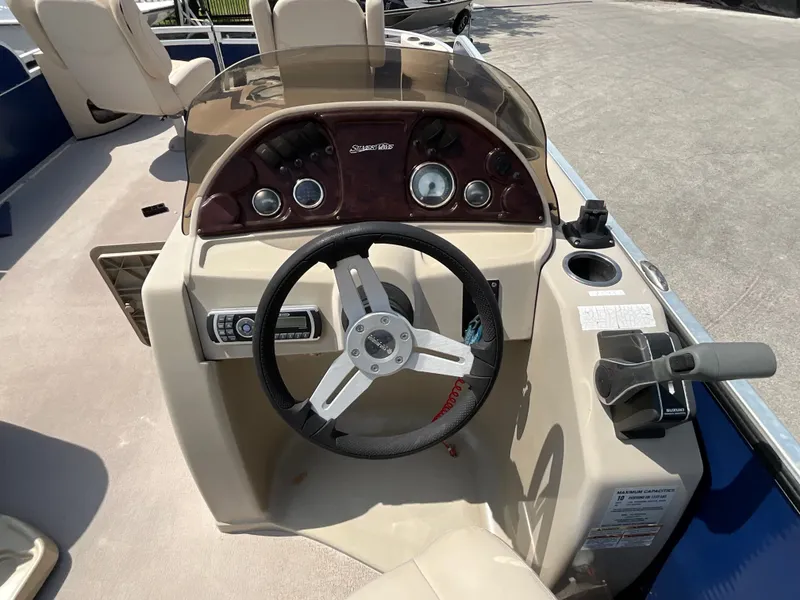 Slide: The Image of The image shows the helm of a 2016 SilverWave 210L with a steering wheel and gauges. - 10