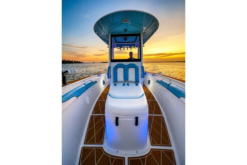 Slide: The Image of 2018 Sea Hunt Gamefish 27 Coffin Box boat at sunset on the water. - 31