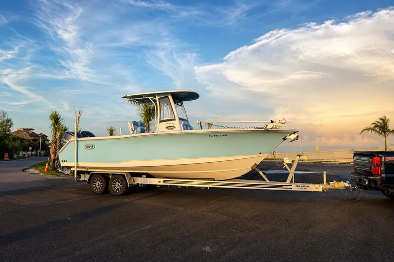 Slide: The Image of 2018 Sea Hunt Gamefish 27 Coffin Box boat on trailer at sunset, ready for adventure. - 44