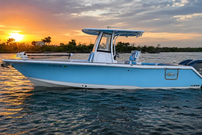 Slide: The Image of 2018 Sea Hunt Gamefish 27 Coffin Box boat on water at sunset. - 11