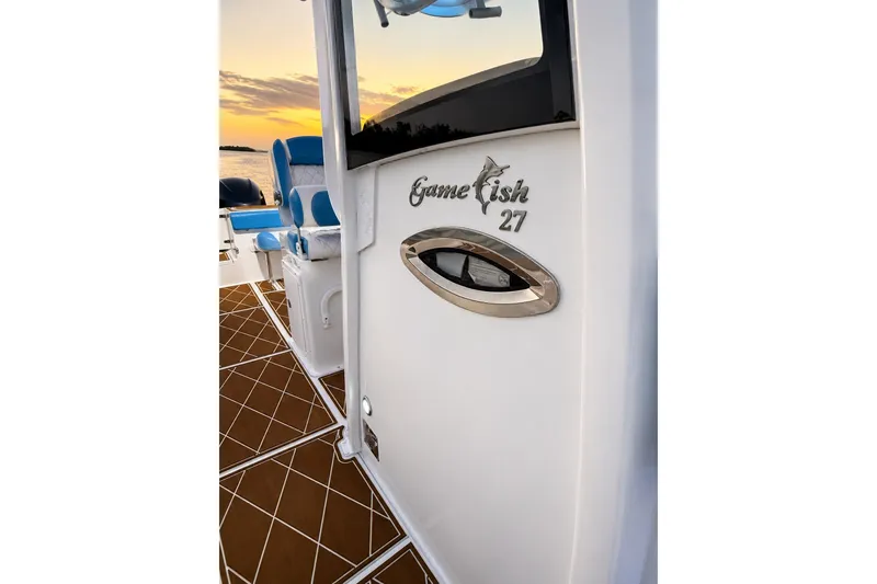 Slide: The Image of 2018 Sea Hunt Gamefish 27 boat interior with sunset view. - 32