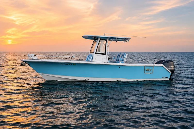 Slide: The Image of 2018 Sea Hunt Gamefish 27 Coffin Box boat on ocean at sunset. - 12