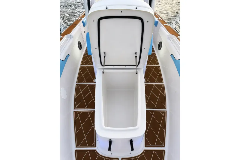 Slide: The Image of 2018 Sea Hunt Gamefish 27 Coffin Box open on boat deck, showcasing spacious storage. - 23
