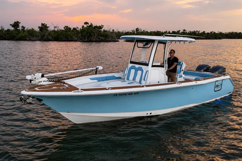 Slide: The Image of 2018 Sea Hunt Gamefish 27 Coffin Box boat on calm water at sunset. - 15