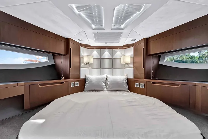 Slide: The Image of Luxurious interior of 2021 Galeon 500 Fly yacht with modern wood finishes and elegant bedding. - 70