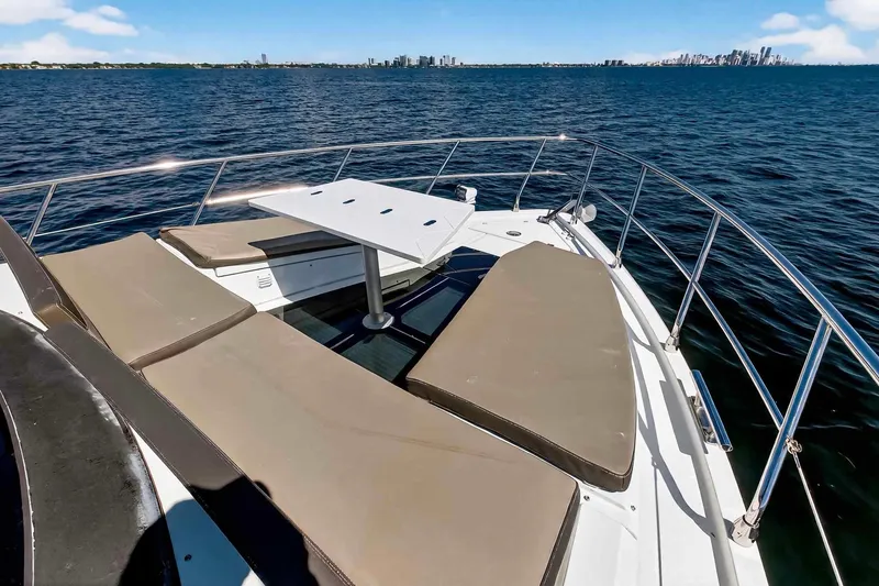 Slide: The Image of 2021 Galeon 500 Fly yacht deck with sun loungers and table, ocean view. - 30