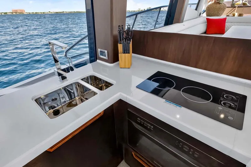 Slide: The Image of Modern kitchen on 2021 Galeon 500 Fly yacht with sleek countertops and appliances. - 56