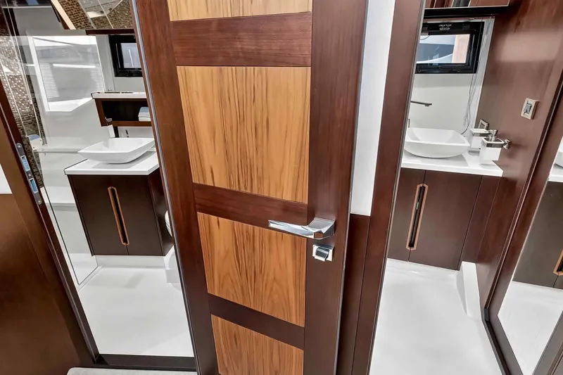 Slide: The Image of Luxurious bathroom interior on 2021 Galeon 500 Fly yacht, featuring modern wood finishes. - 77