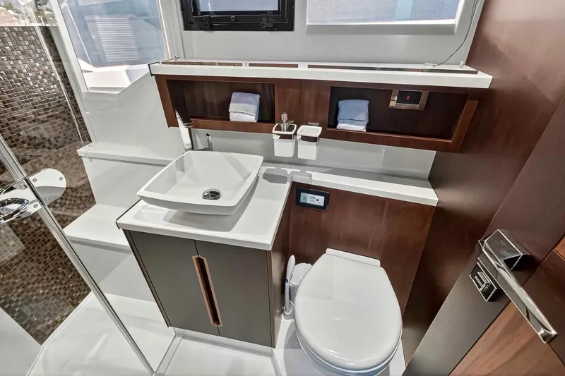 Slide: The Image of Luxurious bathroom interior of 2021 Galeon 500 Fly yacht, featuring modern sink and toilet. - 91