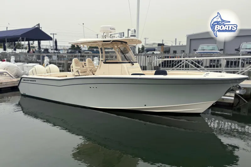 The Image of 2024 Grady-White Canyon 306 boat docked at marina, showcasing sleek design and modern features. - 0