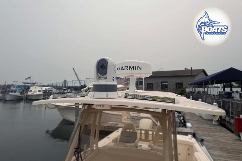 Slide: The Image of 2024 Grady-White Canyon 306 boat with Garmin radar at a marina dock. - 10