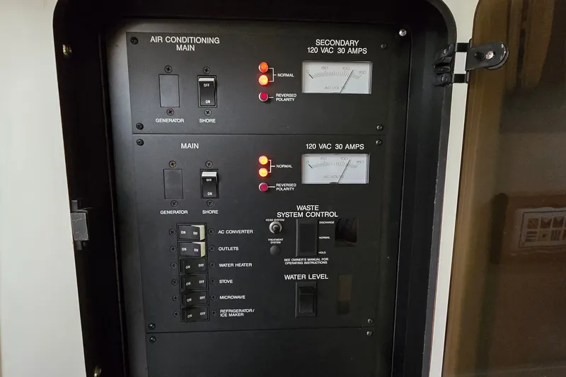 Slide: The Image of Electrical control panel on a 1994 Sea Ray 370 Express Cruiser boat. - 24