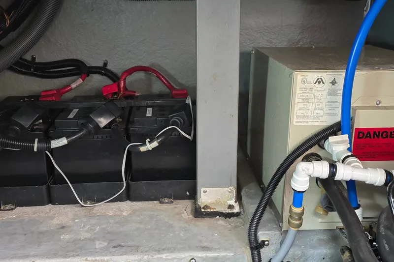 Slide: The Image of Battery and electrical system inside a 1994 Sea Ray 370 Express Cruiser boat. - 34