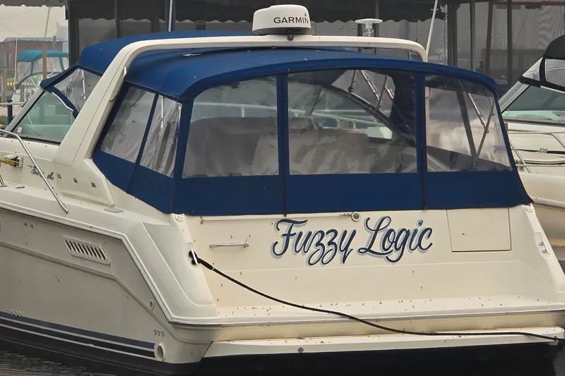 Slide: The Image of 1994 Sea Ray 370 Express Cruiser named "Fuzzy Logic" docked at marina. - 5