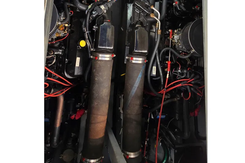Slide: The Image of Engine compartment of a 1994 Sea Ray 370 Express Cruiser with visible components and wiring. - 41