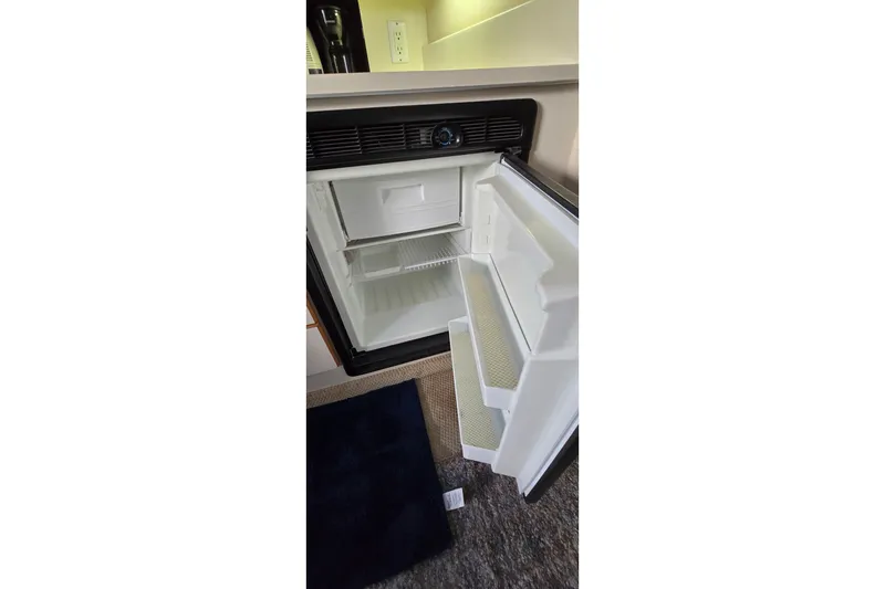 Slide: The Image of Open refrigerator inside 1994 Sea Ray 370 Express Cruiser yacht cabin. - 32
