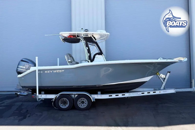 The Image of 2021 Key West 244 Center Console boat on trailer, side view, with Yamaha engine. - 0