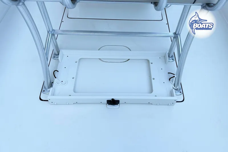 Slide: The Image of 2021 Key West 244 Center Console boat deck with metal frame and storage compartment. - 8