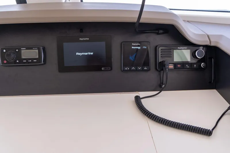 Slide: The Image of Control panel of a 2020 Bali 4.1 yacht featuring Raymarine navigation equipment. - 17