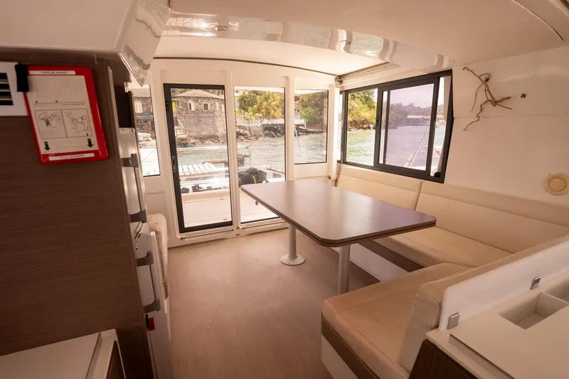 Slide: The Image of Interior of 2020 Bali 4.1 catamaran with spacious seating and waterfront view. - 12