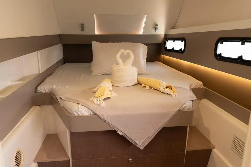 Slide: The Image of Luxurious cabin interior of 2020 Bali 4.1 yacht with elegant bedding and ambient lighting. - 19