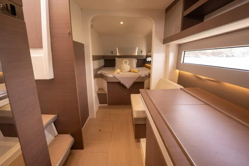 Slide: The Image of Luxurious interior of a 2020 Bali 4.1 yacht, featuring modern wood finishes and cozy seating. - 18