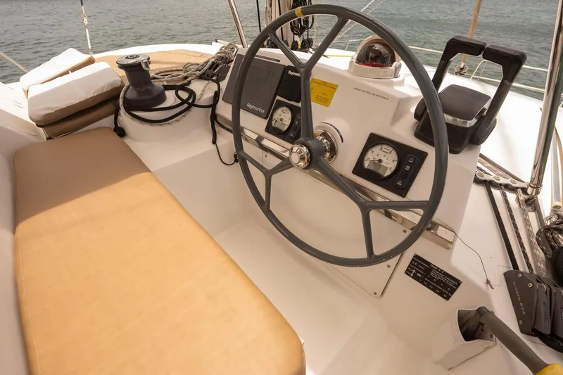 Slide: The Image of Cockpit of 2020 Bali 4.1 sailboat with steering wheel and navigation instruments. - 27