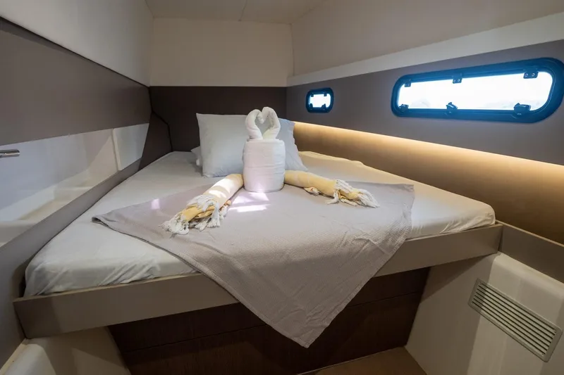 Slide: The Image of Cozy cabin interior of 2020 Bali 4.1 yacht with elegant bedding and soft lighting. - 22