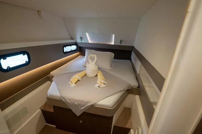 Slide: The Image of Cozy cabin interior of 2020 Bali 4.1 yacht with elegant bedding and ambient lighting. - 23
