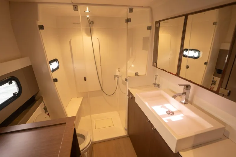 Slide: The Image of Modern yacht bathroom with shower, sink, and mirror in a 2020 Bali 4.1 model. - 21