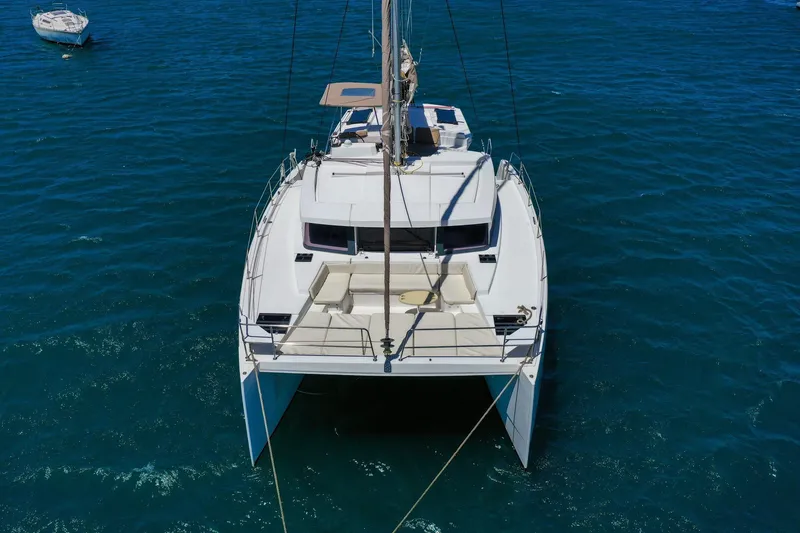Slide: The Image of Aerial view of a 2020 Bali 4.1 catamaran sailing on clear blue water. - 32