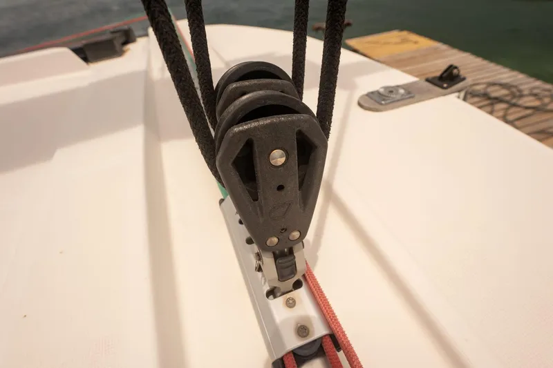 Slide: The Image of Close-up of a 2020 Bali 4.1 sailboat pulley system on deck. - 37