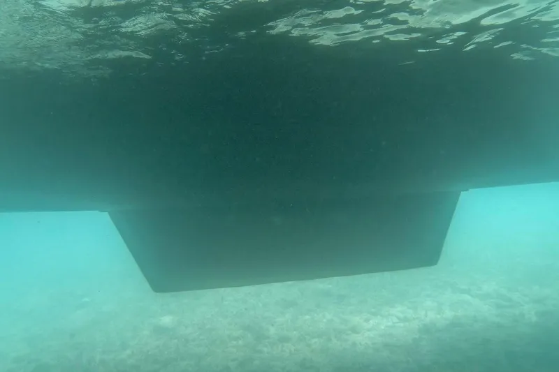Slide: The Image of Underwater view of Bali 4.1 catamaran hull, 2020 model, in clear blue water. - 44